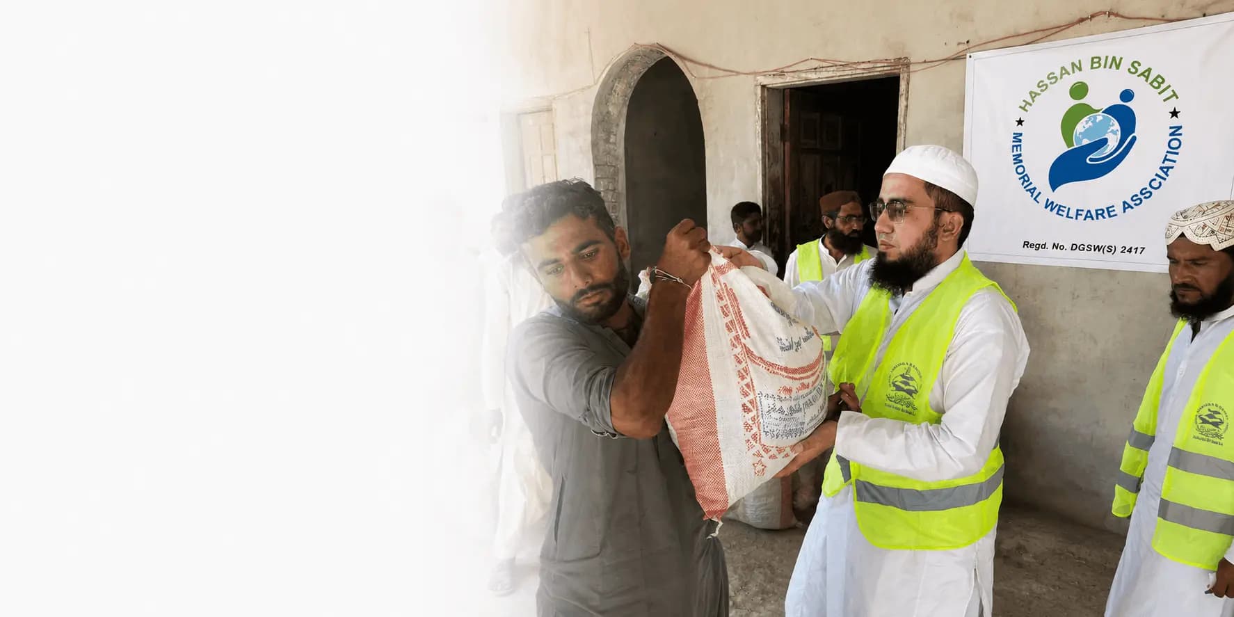 HBSMWA volunteers distributing food packages to a family in need